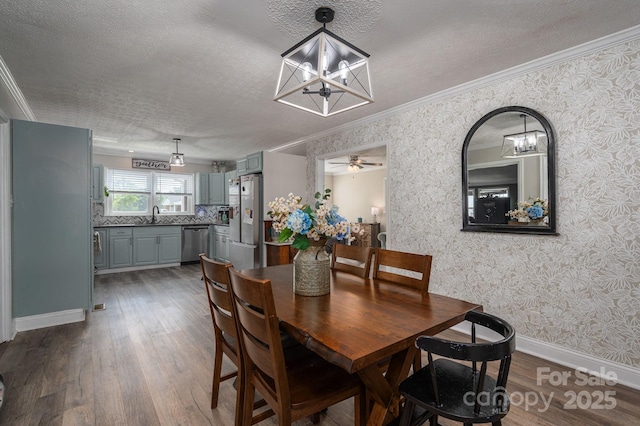 2206 Whitworth Rd, Cherryville, NC 28021 - dining area featuring a chandelier, dark wood finished floors, a textured ceiling, crown molding, and wallpapered walls