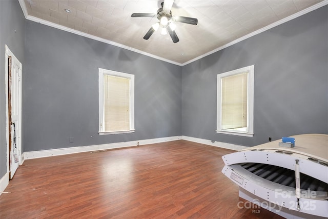 1637 N College Ave, Newton, NC 28658 - unfurnished bedroom with crown molding, wood finished floors, baseboards, and a ceiling fan