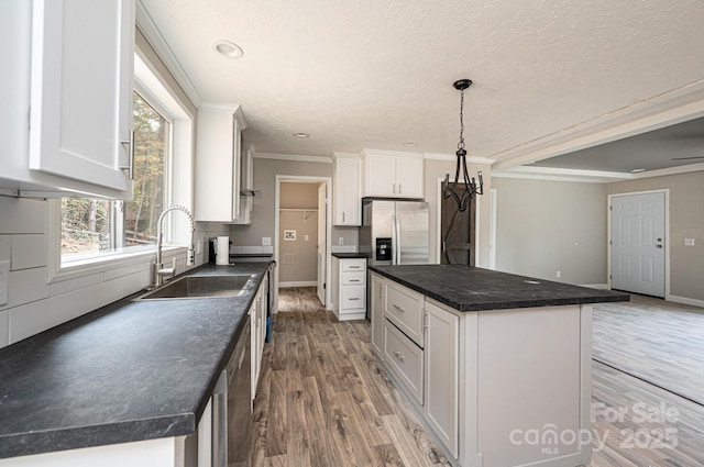 122 River Ridge Lane, Hickory, NC 28601 - kitchen with a sink, stainless steel fridge with ice dispenser, dark countertops, wood finished floors, and ornamental molding