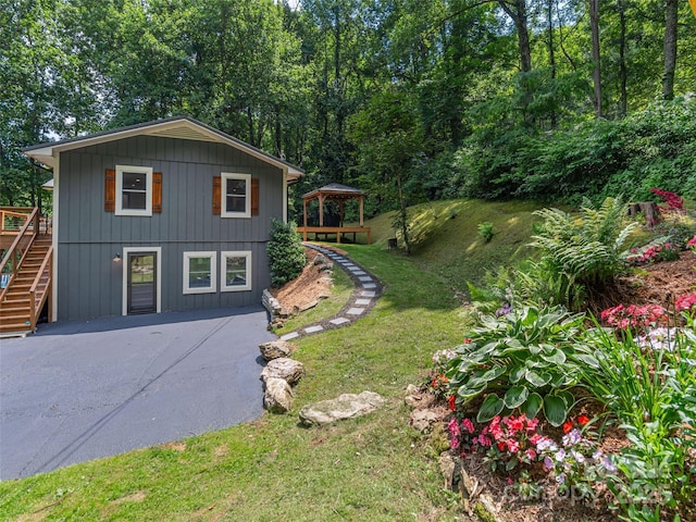 1903 Mauney Cove Rd, Waynesville, NC 28786 - view of property exterior with a gazebo, stairs, a lawn, and a wooden deck