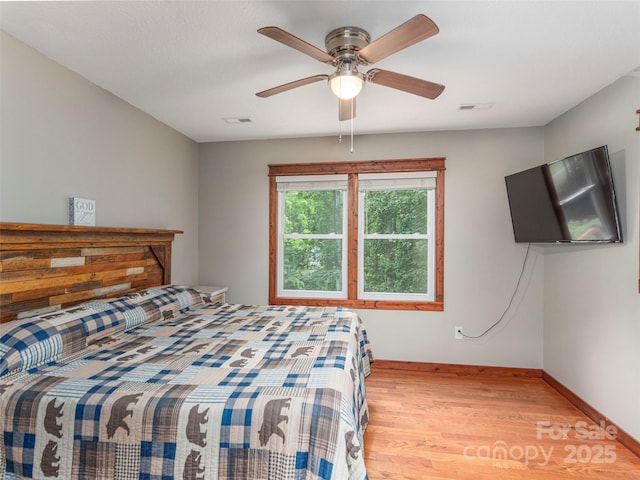 1903 Mauney Cove Rd, Waynesville, NC 28786 - bedroom with wood finished floors and a ceiling fan
