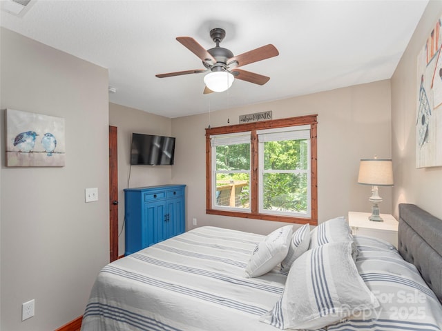 1903 Mauney Cove Rd, Waynesville, NC 28786 - bedroom featuring a ceiling fan and baseboards