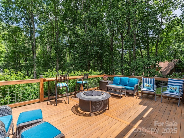 1903 Mauney Cove Rd, Waynesville, NC 28786 - deck featuring an outdoor living space with a fire pit
