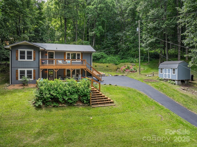 1903 Mauney Cove Rd, Waynesville, NC 28786 - back of house featuring stairway, a yard, asphalt driveway, a metal roof, and a deck
