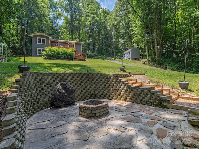 1903 Mauney Cove Rd, Waynesville, NC 28786 - view of patio with stairs, an outdoor fire pit, and an outdoor structure