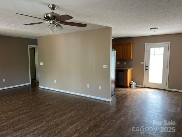 22 Congress St, Granite Falls, NC 28630 - unfurnished living room with dark wood-type flooring, ceiling fan, and a textured ceiling