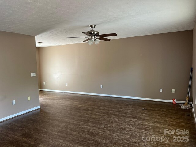22 Congress St, Granite Falls, NC 28630 - empty room featuring a textured ceiling, a ceiling fan, and dark wood-type flooring