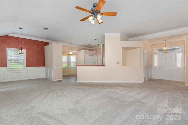 137 Citation Dr, Mooresville, NC 28117 - unfurnished living room with a ceiling fan, carpet flooring, ornamental molding, a wainscoted wall, and lofted ceiling