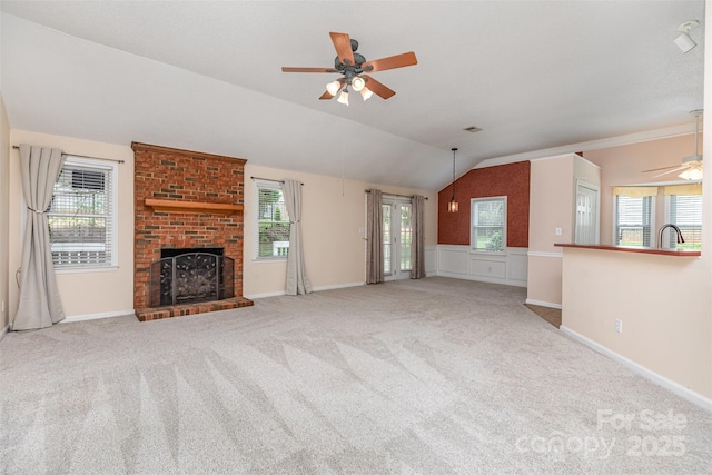 137 Citation Dr, Mooresville, NC 28117 - unfurnished living room with a ceiling fan, lofted ceiling, a brick fireplace, carpet, and healthy amount of natural light