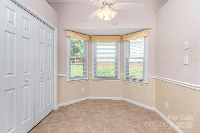 137 Citation Dr, Mooresville, NC 28117 - unfurnished bedroom featuring light tile patterned flooring, a closet, and a ceiling fan