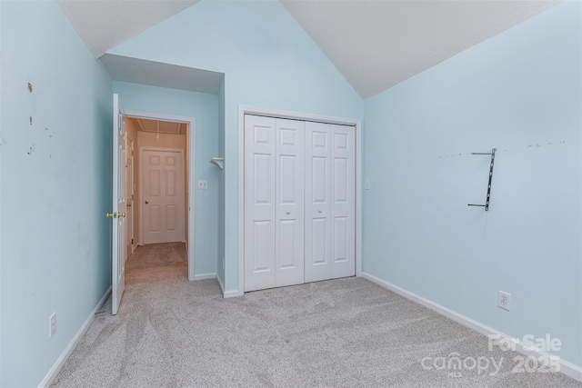 137 Citation Dr, Mooresville, NC 28117 - unfurnished bedroom with attic access, lofted ceiling, light carpet, and a closet