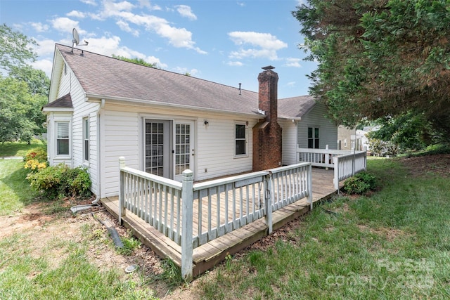 137 Citation Dr, Mooresville, NC 28117 - rear view of house featuring a shingled roof, a deck, a lawn, and a chimney