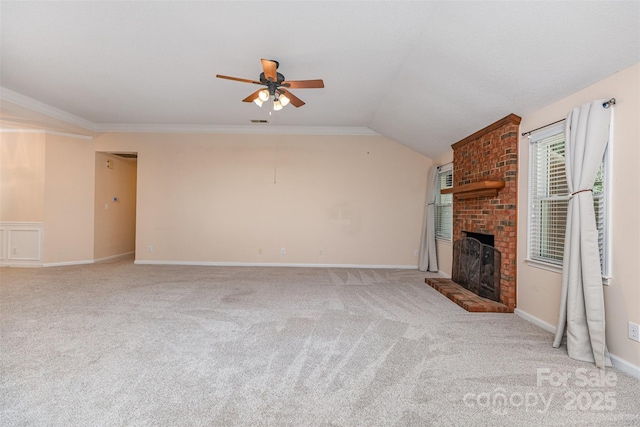 137 Citation Dr, Mooresville, NC 28117 - unfurnished living room with carpet floors, a ceiling fan, a brick fireplace, lofted ceiling, and crown molding
