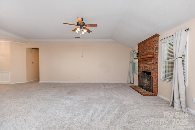 137 Citation Dr, Mooresville, NC 28117 - unfurnished living room featuring carpet, a brick fireplace, ceiling fan, lofted ceiling, and ornamental molding