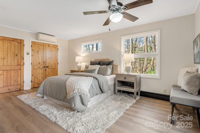 471 Highlands View Rd, Highlands, NC 28741 - bedroom with an AC wall unit, wood finished floors, a ceiling fan, and crown molding
