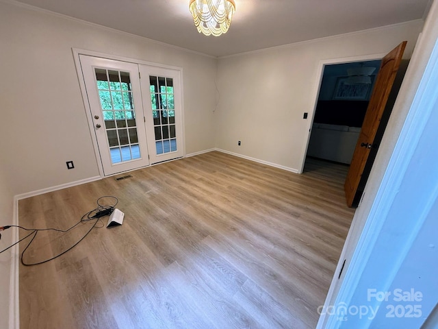 471 Highlands View Rd, Highlands, NC 28741 - spare room featuring ornamental molding, wood finished floors, baseboards, and a chandelier