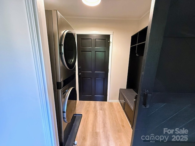471 Highlands View Rd, Highlands, NC 28741 - mudroom with stacked washer and clothes dryer, wood finished floors, and ornamental molding