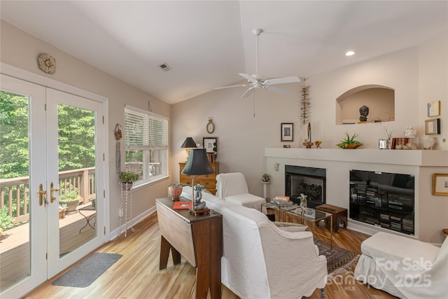 73 Ridgetop Cir Unit 302, Brevard, NC 28712 - living area featuring light wood-style floors, a glass covered fireplace, ceiling fan, recessed lighting, and french doors
