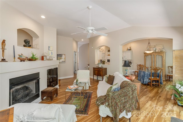 73 Ridgetop Cir Unit 302, Brevard, NC 28712 - living area featuring a fireplace, lofted ceiling, a ceiling fan, light wood-type flooring, and recessed lighting