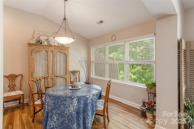 73 Ridgetop Cir Unit 302, Brevard, NC 28712 - dining area featuring healthy amount of natural light, vaulted ceiling, and wood finished floors