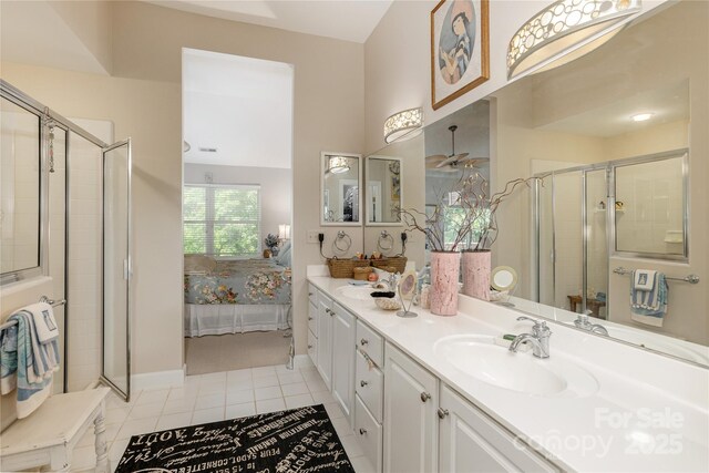 73 Ridgetop Cir Unit 302, Brevard, NC 28712 - ensuite bathroom with double vanity, a stall shower, and tile patterned flooring