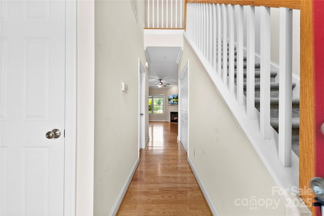 2765 Clover Rd NW, Concord, NC 28027 - hallway featuring wood finished floors, baseboards, and stairs