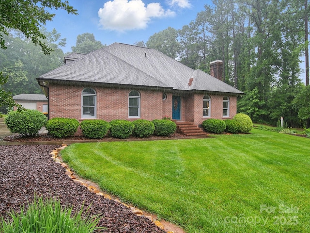 733 Killian Rd, Stanley, NC 28164 - view of front facade with a chimney, a front lawn, brick siding, and roof with shingles