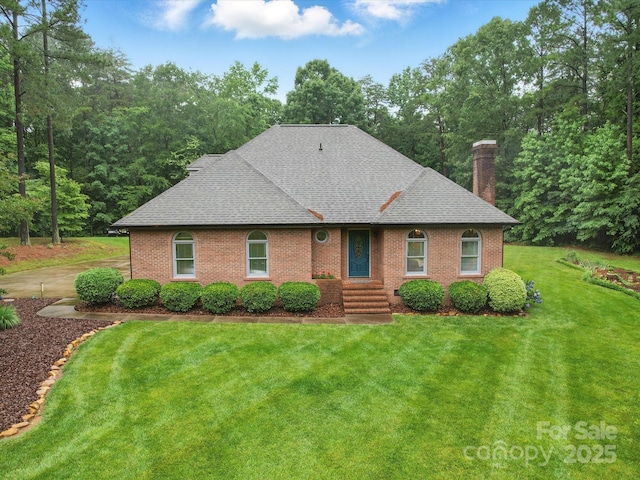 733 Killian Rd, Stanley, NC 28164 - view of front of property with a shingled roof, a chimney, a front yard, and brick siding