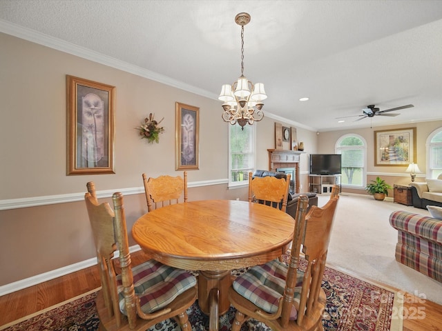733 Killian Rd, Stanley, NC 28164 - dining room featuring a chandelier, baseboards, crown molding, ceiling fan, and a textured ceiling