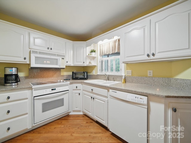 733 Killian Rd, Stanley, NC 28164 - kitchen with white appliances, a sink, white cabinets, light wood-style flooring, and open shelves