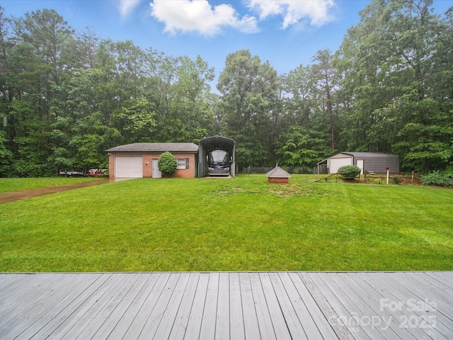 733 Killian Rd, Stanley, NC 28164 - view of grassy yard with an outdoor structure, a garage, a carport, and driveway