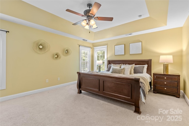1336 Dobson Dr, Waxhaw, NC 28173 - bedroom with light carpet, a raised ceiling, and ceiling fan