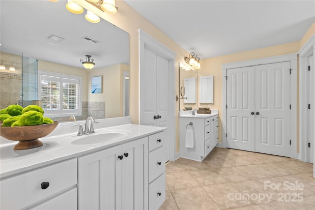 1336 Dobson Dr, Waxhaw, NC 28173 - full bathroom featuring two vanities and tile patterned floors