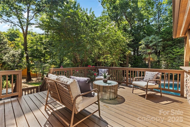 1336 Dobson Dr, Waxhaw, NC 28173 - wooden terrace featuring outdoor lounge area, an outdoor pool, and view of scattered trees
