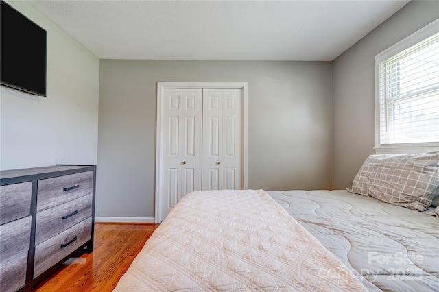 3413 Fallston Rd, Shelby, NC 28150 - bedroom with wood finished floors, a closet, and baseboards