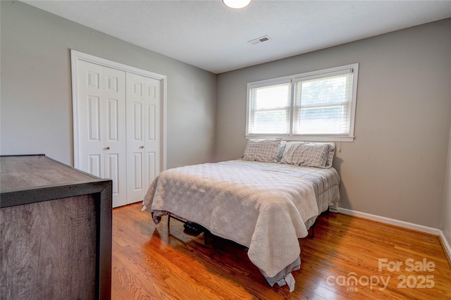 3413 Fallston Rd, Shelby, NC 28150 - bedroom with a closet, light wood finished floors, and baseboards