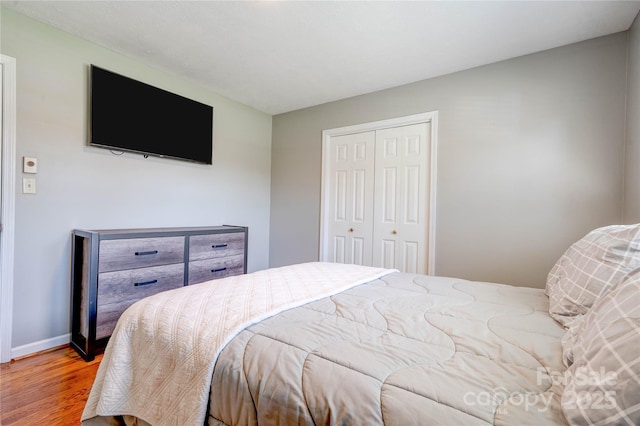3413 Fallston Rd, Shelby, NC 28150 - bedroom featuring wood finished floors, a closet, and baseboards