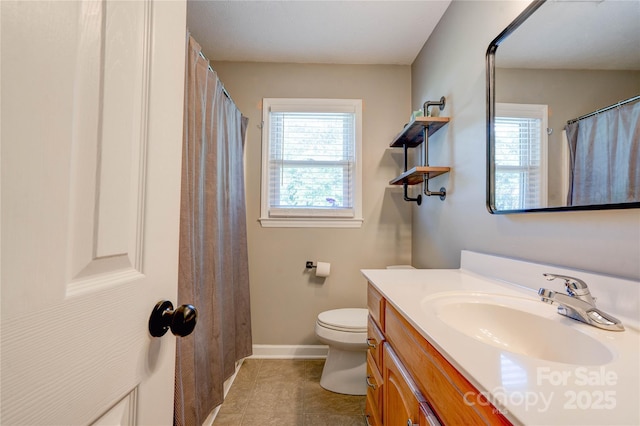 3413 Fallston Rd, Shelby, NC 28150 - bathroom with vanity, toilet, baseboards, and tile patterned flooring