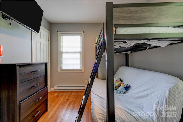 3413 Fallston Rd, Shelby, NC 28150 - bedroom featuring a baseboard heating unit, light wood-type flooring, and baseboards