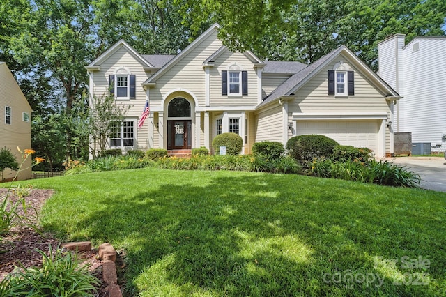 12712 Hollyhock Ln, Huntersville, NC 28078 - traditional-style home featuring a front yard, driveway, and a garage