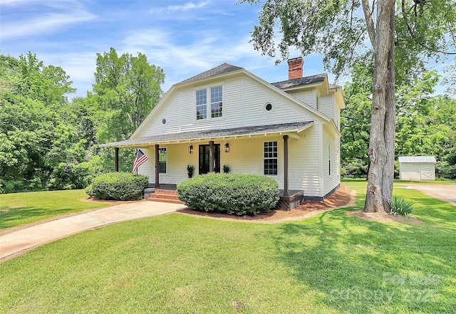 604 Ferguson Ridge Rd, Gastonia, NC 28052 - view of front of home featuring a chimney, roof with shingles, a front yard, and covered porch
