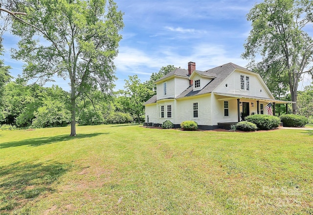 604 Ferguson Ridge Rd, Gastonia, NC 28052 - view of home's exterior featuring a chimney and a lawn
