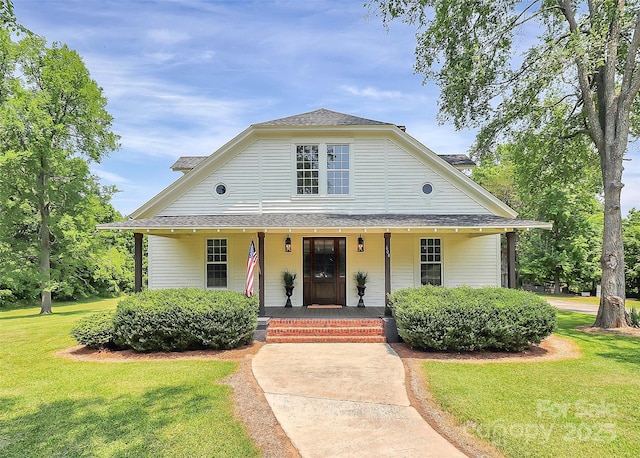 604 Ferguson Ridge Rd, Gastonia, NC 28052 - view of front facade featuring a porch, a front lawn, and a shingled roof