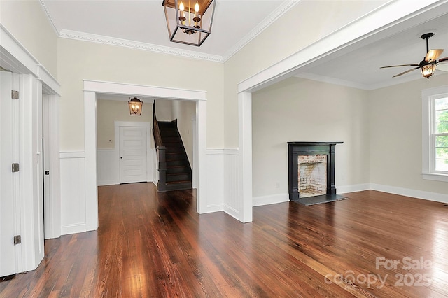 604 Ferguson Ridge Rd, Gastonia, NC 28052 - unfurnished living room featuring wood finished floors, stairway, a ceiling fan, a fireplace, and ornamental molding