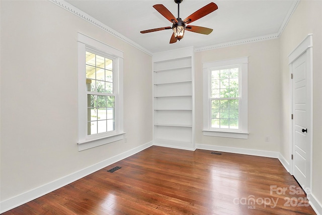 604 Ferguson Ridge Rd, Gastonia, NC 28052 - empty room featuring built in features, dark wood-style flooring, ornamental molding, a ceiling fan, and baseboards