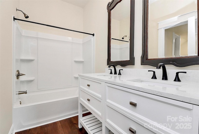 604 Ferguson Ridge Rd, Gastonia, NC 28052 - bathroom featuring shower / bathtub combination, double vanity, and wood finished floors