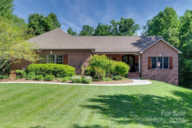 103 3rd St SW, Catawba, NC 28609 - view of front of property with a front lawn, brick siding, and roof with shingles