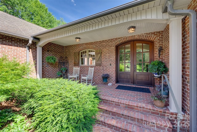 103 3rd St SW, Catawba, NC 28609 - view of exterior entry featuring french doors, brick siding, and covered porch