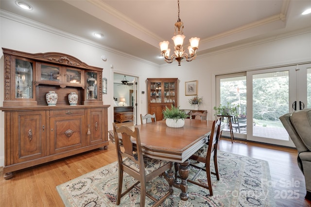 103 3rd St SW, Catawba, NC 28609 - dining space featuring light wood-type flooring, a chandelier, a raised ceiling, ornamental molding, and ceiling fan
