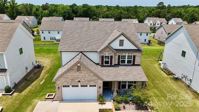 7651 Fenn Way, Fort Mill, SC 29707 - traditional-style home with brick siding, a garage, driveway, and roof with shingles